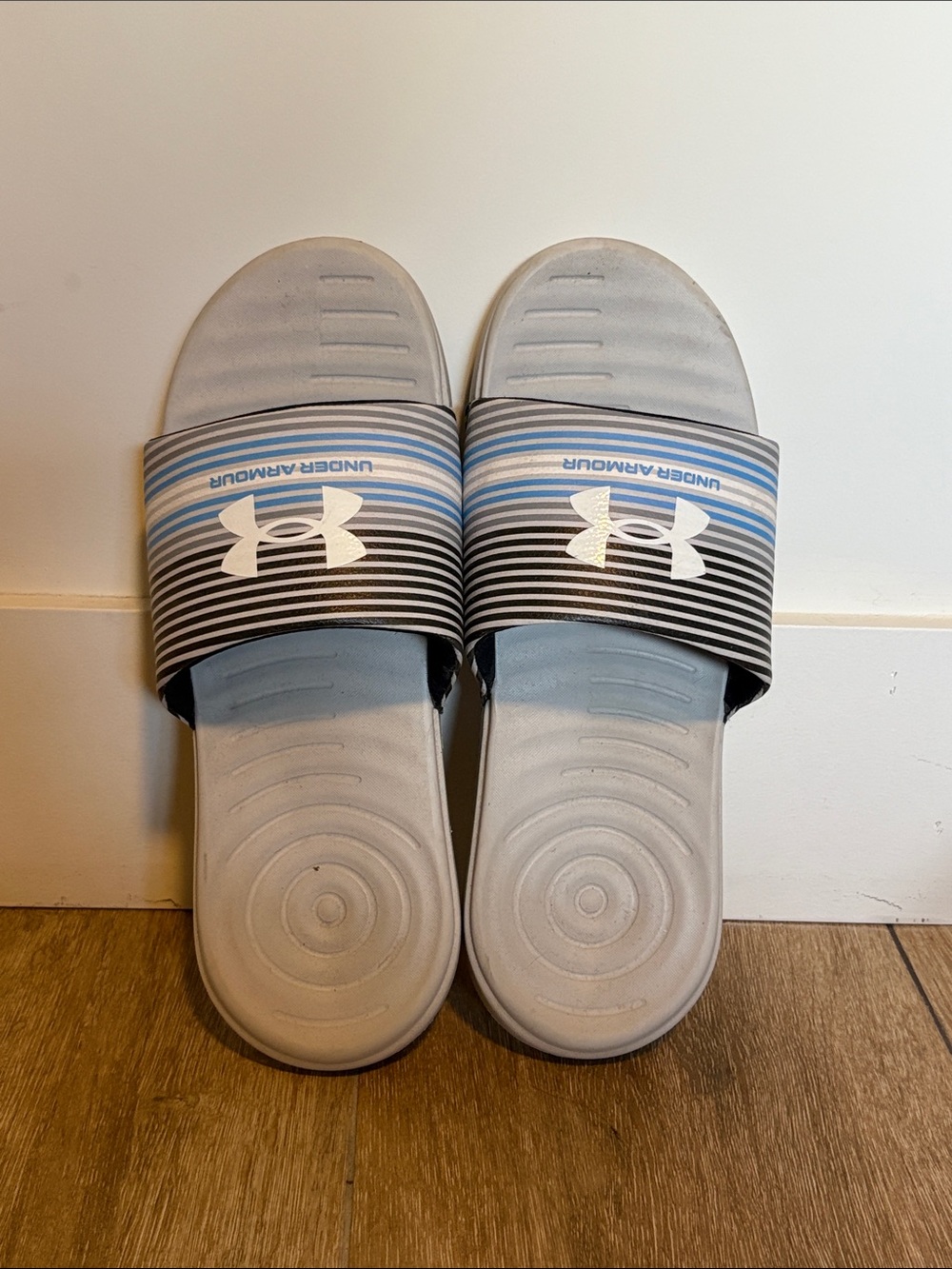 Under Armour Light Gray Slides with Blue and Black Striped Strap